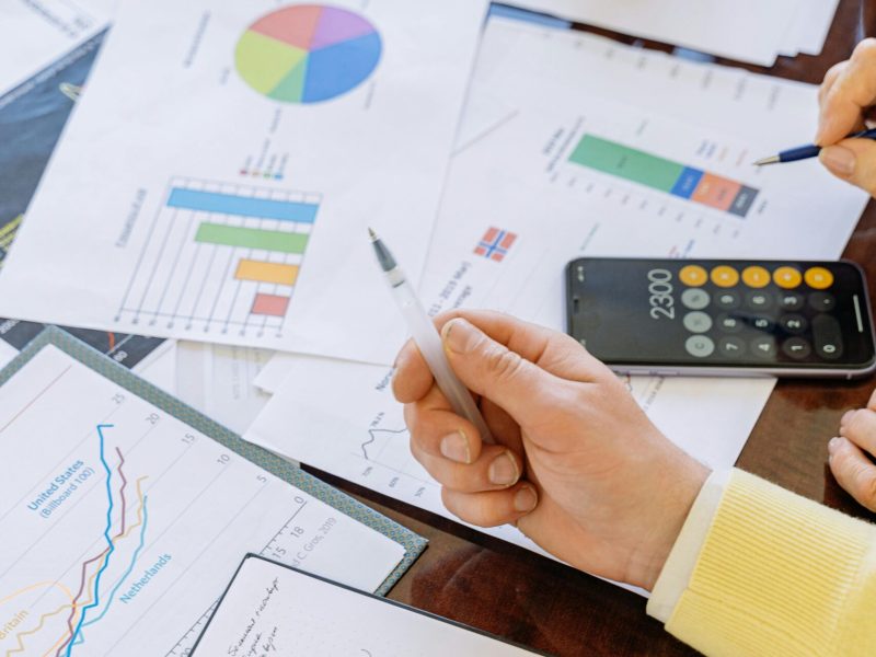 Business team analyzing a performance report with charts and data